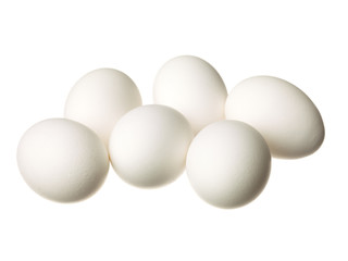 half dozen eggs displayed on white