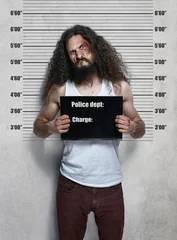 Fototapeten Funny portrait of a skinny criminal © konradbak