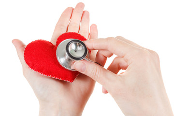 Fototapeta premium Red heart and a stethoscope on white background