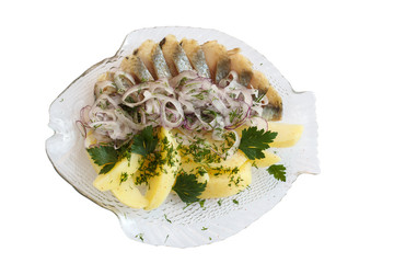Herring with onion on a plate in the form of fish