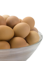 a bowl with brown eggs