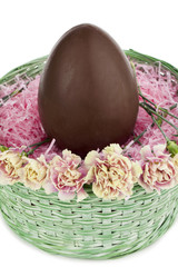 green basket with flowers and brown egg.
