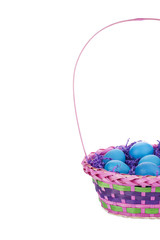 pink basket with easter eggs and confetti