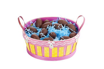 pink basket with chocolates and confetti