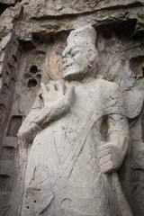 Obraz premium Porter's statue rock carving at Longmen Grottoes, Luoyang , Hena