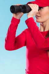 Lifeguard supervising with binoculars.