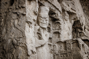 Porter's statue rock carving at Longmen Grottoes, Luoyang , Hena