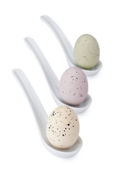 three spotted easter eggs on ladle