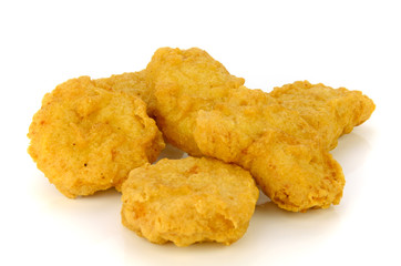 Fried chicken nuggets isolated on white background.