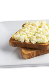 cropped image of egg salad sandwich in plate