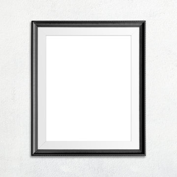 Black picture frame on white wall.