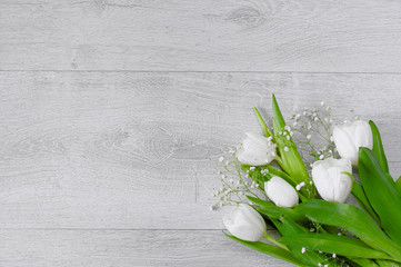 White tulips on grey background. Post card, gift card template. Floral background. Copy space for your text