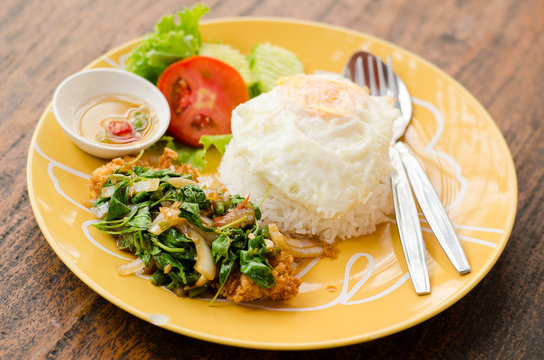 Thai food,spicy stir-fried crispy chicken with basil,fried egg and rice (Kapao kai Khai dao)