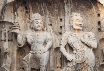 Fototapeta na wymiar Porter's statue rock carving at Longmen Grottoes, Luoyang , Hena