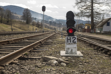 traffic light with red signal on the railroad
