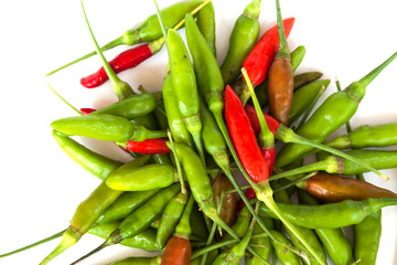 Red and green chilli peppers on white background