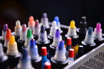 Box with tubes of ink for tattoos