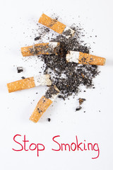 Cigarette butts and ash, stop tobacco save your life