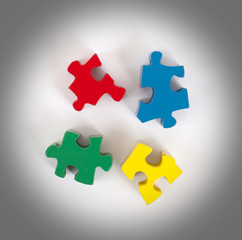 Obraz premium Closeup of 4 big jigsaw puzzle pieces
