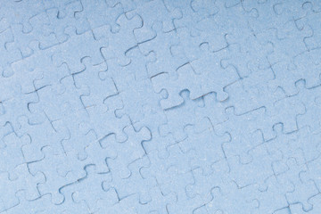 Connected blue puzzle pieces isolated