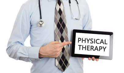 Doctor holding tablet - Physical therapy