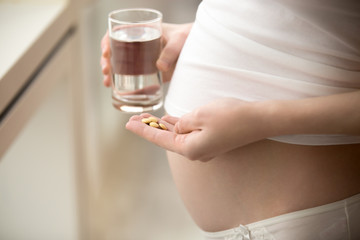 Pregnant woman with pills