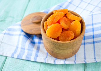 dried apricots on wooden table