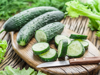 Cucumbers on the wooden table.