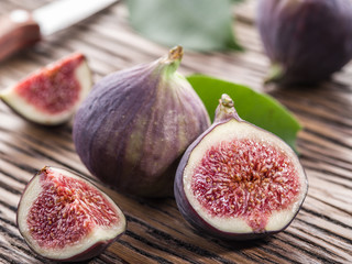 Ripe fig fruits on the wooden table.