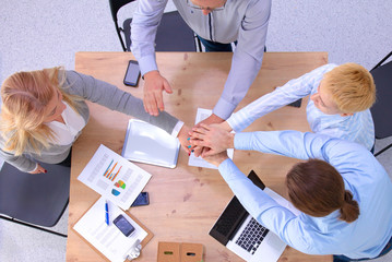 Image of business partners discussing documents and ideas at meeting