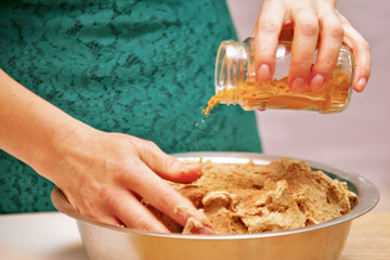 Making bread knead dough, buns close up