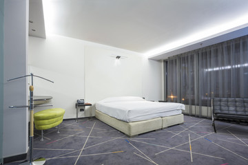 Fototapeta na wymiar Modern hotel bedroom interior