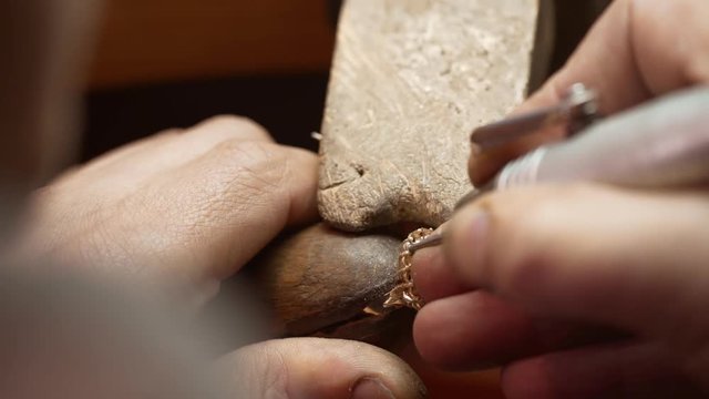 At the jeweller's workshop. Close up. Slow motion