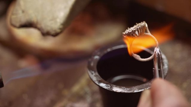 At the jeweller's workshop. Close up. Slow motion