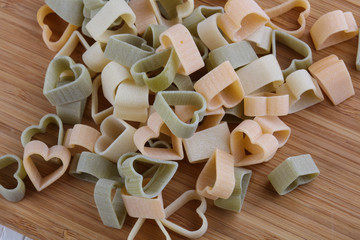 Raw pasta hearts symbols