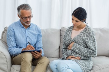 Therapist consoling a woman
