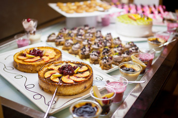 Obraz na płótnie Canvas Cakes and pastries on buffet table