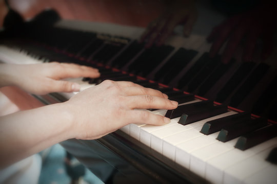 Close up of musician playing a piano