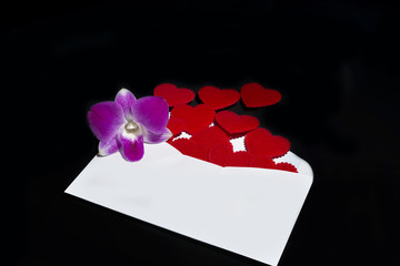 Red hearts popping out from envelope
