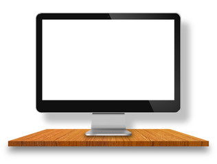 Computer Monitor on wood table with white wall background