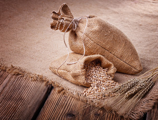 Sacks of grain and wheat ears
