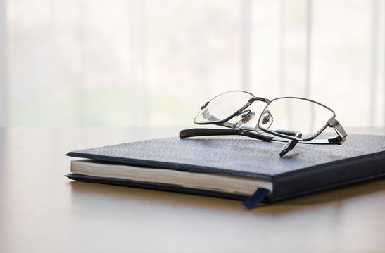 Glasses on a book