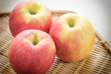 Red apple in basket