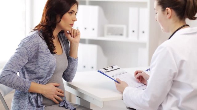 gynecologist and pregnant woman at hospital