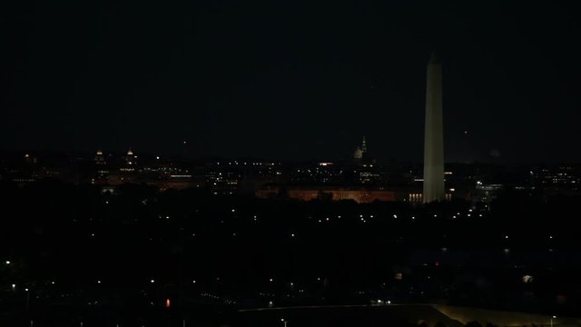 Washington Monument and night cityscape in Washington DC, USA.