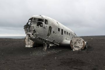 Fototapeta na wymiar Airplane wreckage on a black sand beach, South Iceland