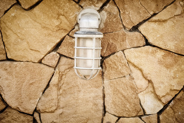 lamp on stone wall