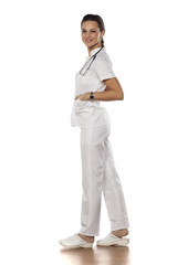 a young woman doctor in uniform on a white background