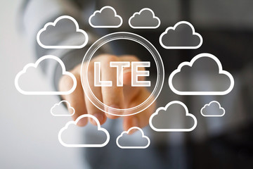 Businessman pushing web button LTE symbol cloud network