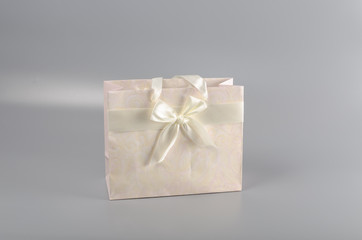 paper bag for gifts and purchases tied ribbon